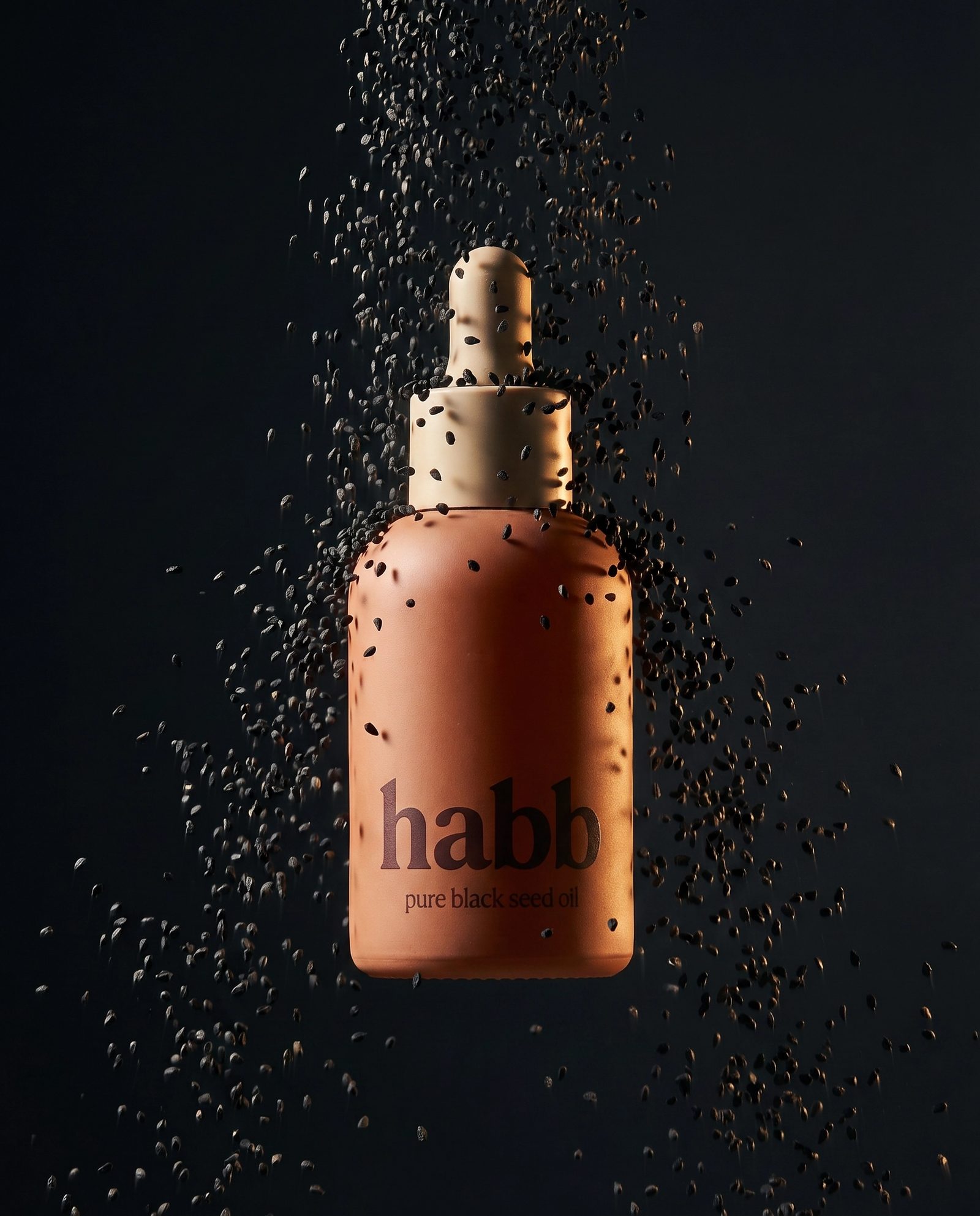 cascade of black seeds on cream linen